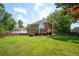 Spacious backyard featuring a deck and a lush lawn, perfect for outdoor activities and relaxation at 2251 Rushmore Dr, Marietta, GA 30062