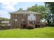 Backyard with two-story brick home and a nice upper deck at 2251 Rushmore Dr, Marietta, GA 30062