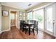 Dining area with a table set near the bay window, offering views of the backyard at 2251 Rushmore Dr, Marietta, GA 30062