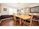 Elegant dining room with hardwood floors, a modern chandelier, and built-in display cabinet at 2251 Rushmore Dr, Marietta, GA 30062