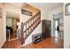 Warm entryway features hardwood floors, stairs and convenient storage for shoes and coats at 2251 Rushmore Dr, Marietta, GA 30062
