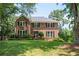 Charming two-story brick home with well-manicured lawn and mature trees in a desirable neighborhood at 2251 Rushmore Dr, Marietta, GA 30062