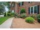 Welcoming walkway leads to this brick home with mature landscaping and charming black shutters at 2251 Rushmore Dr, Marietta, GA 30062