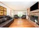Spacious living room with hardwood floors, brick fireplace and built-in shelves, creating a cozy atmosphere at 2251 Rushmore Dr, Marietta, GA 30062