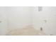 Basement featuring concrete flooring and white walls, ready to be finished at 914 Hemingway Rd, Stone Mountain, GA 30088