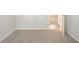 Neutral bedroom featuring carpet flooring, neutral walls, and an open doorway at 914 Hemingway Rd, Stone Mountain, GA 30088