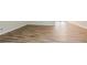 Close-up view of hardwood floors with clean white baseboards and neutral-painted walls at 914 Hemingway Rd, Stone Mountain, GA 30088