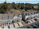 Aerial shot of modern townhomes in a wooded setting, featuring decks, parking, and surrounding greenery at 2736 Bell Se Dr, Smyrna, GA 30080