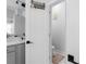 Modern half bathroom with a door leading to the toilet and sink at 2736 Bell Se Dr, Smyrna, GA 30080