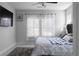 Main bedroom with decorative curtains, television, and a plush rug on carpet at 2736 Bell Se Dr, Smyrna, GA 30080