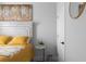 Bedroom with a decorative painting above the bed, accented by natural light and a neutral palette at 2736 Bell Se Dr, Smyrna, GA 30080