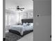 View of main bedroom showcases a gray tufted headboard and neutral decor at 2736 Bell Se Dr, Smyrna, GA 30080