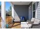 A cozy outdoor deck features comfortable seating and a charming ambiance for relaxing or entertaining guests at 2736 Bell Se Dr, Smyrna, GA 30080