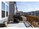 Large deck with barbecue grill and an outdoor rug overlooks the neighborhood at 2736 Bell Se Dr, Smyrna, GA 30080