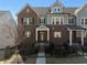 Charming townhome with brick and gray siding, black shutters, and a gated front yard at 2736 Bell Se Dr, Smyrna, GA 30080