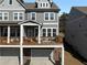 Charming townhouse featuring a spacious deck perfect for outdoor entertaining and an attached two-car garage at 2736 Bell Se Dr, Smyrna, GA 30080