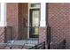 Inviting front porch with brick facade, black railing, and column details at 2736 Bell Se Dr, Smyrna, GA 30080