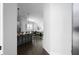 Hallway view of kitchen with barstool seating and dining area with hardwood floors at 2736 Bell Se Dr, Smyrna, GA 30080