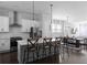 Bright open-concept kitchen featuring an island with bar seating and stainless steel appliances at 2736 Bell Se Dr, Smyrna, GA 30080