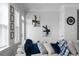 Bright and open living room features an oversized sofa and lots of natural light streaming through the windows at 2736 Bell Se Dr, Smyrna, GA 30080