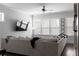 Bright and cozy living room featuring an oversized sofa and lots of natural light streaming through the windows at 2736 Bell Se Dr, Smyrna, GA 30080