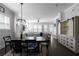 Open-concept space boasts a dining area and living room featuring hardwood floors and lots of natural light at 2736 Bell Se Dr, Smyrna, GA 30080