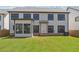 Home exterior highlighting a well-maintained lawn, multiple windows, and partial privacy fence at 5340 Candun Cir, Sugar Hill, GA 30518