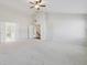 Large bedroom with vaulted ceilings and multiple doors at 5340 Candun Cir, Sugar Hill, GA 30518