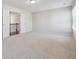 A spacious bedroom with neutral carpet and natural light from a window at 5340 Candun Cir, Sugar Hill, GA 30518