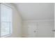 An attic room with a closet and a window providing natural light at 5340 Candun Cir, Sugar Hill, GA 30518