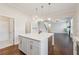 Kitchen island with white countertop and ample storage at 5340 Candun Cir, Sugar Hill, GA 30518