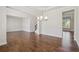 Open-concept living area with hardwood floors, a fireplace, and a seamless transition to the kitchen at 5340 Candun Cir, Sugar Hill, GA 30518