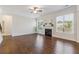Bright living room featuring a fireplace, ceiling fan, and large windows at 5340 Candun Cir, Sugar Hill, GA 30518