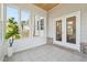 Sunroom with windows, white door, and planked ceiling at 5340 Candun Cir, Sugar Hill, GA 30518