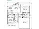 Open-concept first floor plan featuring a vaulted great room, kitchen, and dining area with a two-car garage at 2557 Casablanca Dr, Conyers, GA 30012