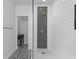 Modern bathroom featuring a glass shower door, unique black and white tile, and sleek, minimalist design at 3475 Oak Valley Ne Rd # 2820, Atlanta, GA 30326