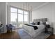 Bedroom featuring hardwood floors, floor-to-ceiling windows, and bed with gray headboard at 3475 Oak Valley Ne Rd # 2820, Atlanta, GA 30326