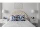 Close-up of a beautifully staged bed with stylish pillows and nightstands, exuding comfort and elegance at 3475 Oak Valley Ne Rd # 2820, Atlanta, GA 30326
