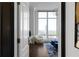 Light-filled bedroom featuring a sitting area with stunning city views and stylish decor through the doorway at 3475 Oak Valley Ne Rd # 2820, Atlanta, GA 30326