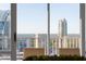 Stunning city view showcasing modern buildings and natural beauty, seen through a large window from a high-rise at 3475 Oak Valley Ne Rd # 2820, Atlanta, GA 30326