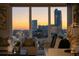 Incredible city skyline view from a high-rise window at dusk, creating a warm and inviting atmosphere at 3475 Oak Valley Ne Rd # 2820, Atlanta, GA 30326