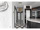 Inviting foyer features black and white marble floors, a unique light fixture and neutral walls at 3475 Oak Valley Ne Rd # 2820, Atlanta, GA 30326