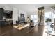 Sunlit living room featuring hardwood floors, modern fireplace, and large windows for city viewing at 3475 Oak Valley Ne Rd # 2820, Atlanta, GA 30326