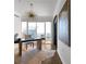 Bright office space featuring hardwood floors, statement lighting fixture and large window with a cityscape view at 3475 Oak Valley Ne Rd # 2820, Atlanta, GA 30326
