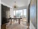 Bright office with sliding barn doors, hardwood floors, statement lighting fixture and large window with a cityscape view at 3475 Oak Valley Ne Rd # 2820, Atlanta, GA 30326