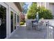 Outdoor patio with dining table, grill, and beautiful garden pathway in a well-maintained community at 3475 Oak Valley Ne Rd # 2820, Atlanta, GA 30326