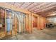 Spacious unfinished basement with utilities and a wood frame at 3688 Eagles Beek Cir, Lithonia, GA 30038