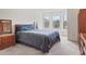 Comfortable bedroom with large windows, a window seat, and carpeted floors at 3688 Eagles Beek Cir, Lithonia, GA 30038