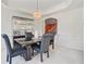 Dining room showcasing modern furnishings, sophisticated display cabinet, and decorative chandelier at 3688 Eagles Beek Cir, Lithonia, GA 30038