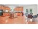 Large kitchen featuring wood cabinets, center island, and breakfast area, perfect for culinary enthusiasts at 3688 Eagles Beek Cir, Lithonia, GA 30038